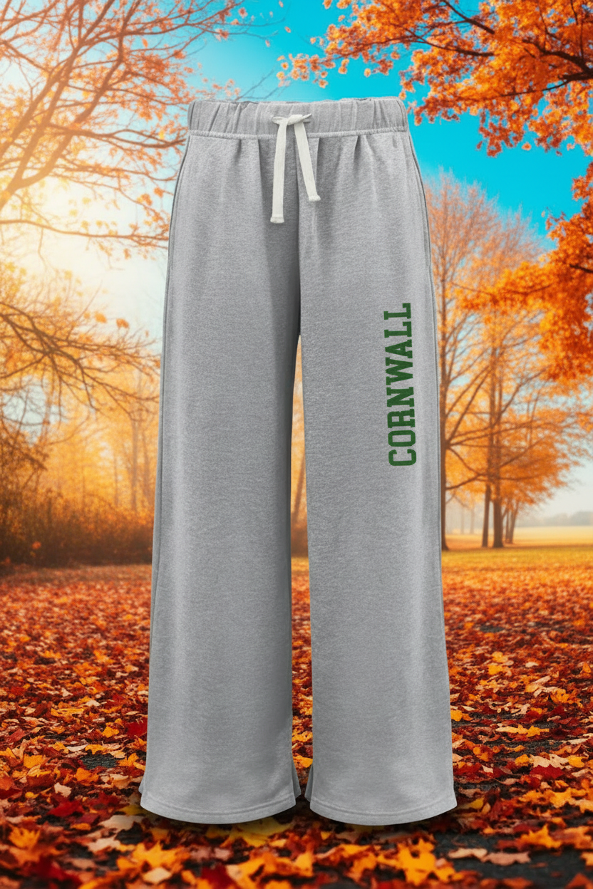 Light heather gray wide-leg sweatpants with a white drawstring and 'CORNWALL' printed vertically in green on the left leg, shown against a plain white background.