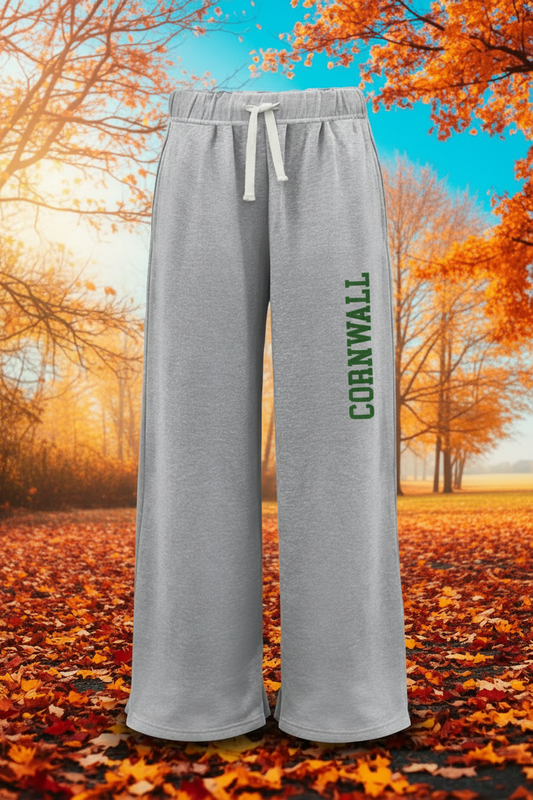 Light heather gray wide-leg sweatpants with a white drawstring and 'CORNWALL' printed vertically in green on the left leg, shown against a plain white background.