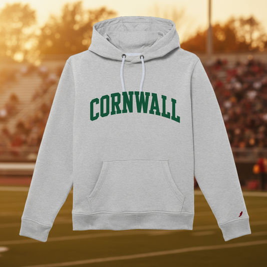 A light heather gray pullover hoodie with 'CORNWALL' printed in dark green varsity-style block letters across the chest. The hoodie features white drawstrings, a front kangaroo pocket, and a small red embroidered bird logo on the left sleeve cuff, shown against a plain white background.